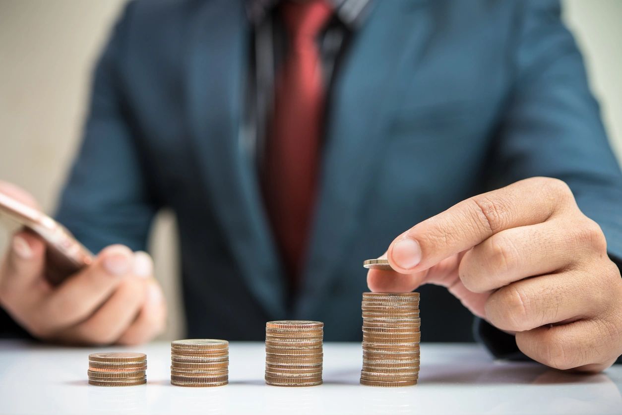 A man holding a coins